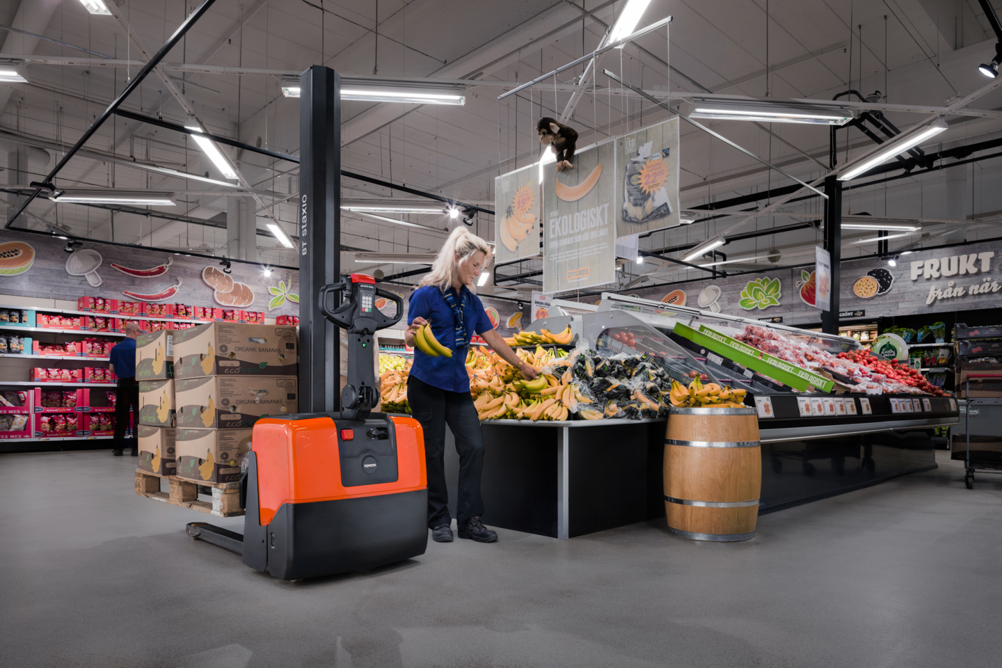 Toyota powered stacker HWE100 utilized as a workbench in a retail environment
