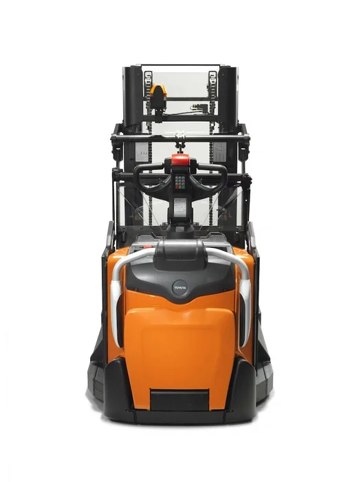 BT Staxio SPE120XRD, electric stacker with reach mast, double load handling, platform, and side guards. Product photo taken from the back.