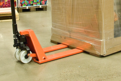 Product photo of hand pallet truck halfway inserted under loaded pallet. 