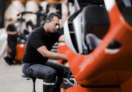 Service technician working on Toyota truck