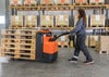 BT Pergo low-lifting powered pallet truck, application photo in warehouse.