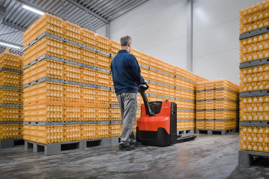 BT Levio LWE powered pallet truck, electric walkie low-lifter. Application photo in warehouse. 