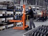 Toyota Lifter SHM080 hand pallet truck, manual stacker with forks raised. Application photo in a manufacturing environment. 