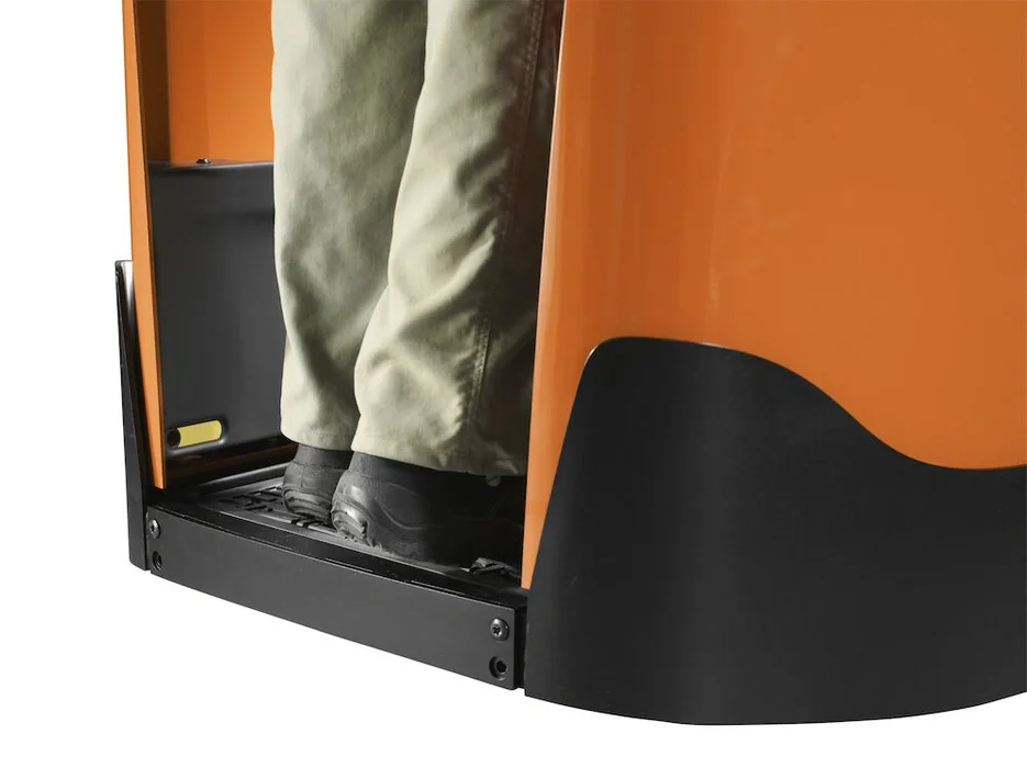 BT Levio LPE200 powered pallet truck, electric low-lifter with fixed side guard option. Details photo taken from the side at an angle illustrating floor and side guards. 
