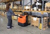 BT Pergo low-lifting powered pallet truck, application photo in warehouse.